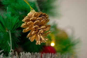 Closeup of a pine cone as a decoration on a Christmas tree