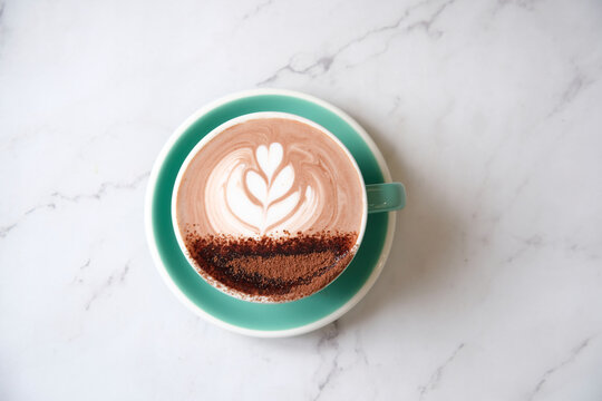 Hot chocolate in teal cup and saucer