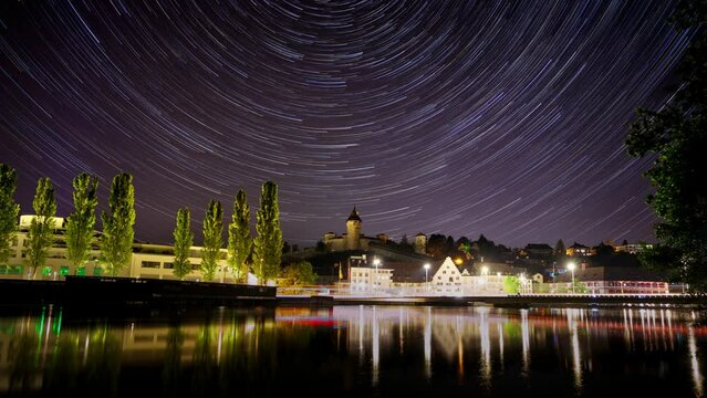 Time lapse night scene of Schaffhausen Munot with illuminating lights by the river in Switzerland