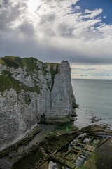 Beautiful seascape with white cliffs at low tides on the coast of Etretat, France