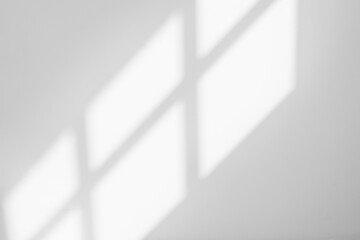 Abstract light reflection and grey shadow from window on white wall background, dark gray shadows...