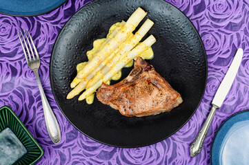 Appetizing meat steak with white asparagus. - 784383126