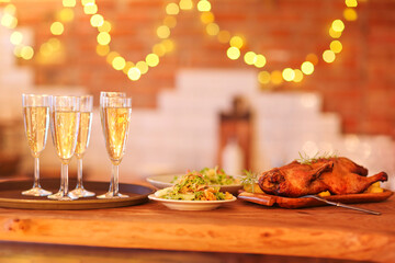 Christmas dinner with roast duck and champagne