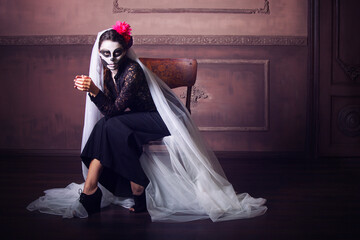 Beautiful woman painted as skeleton. Halloween theme