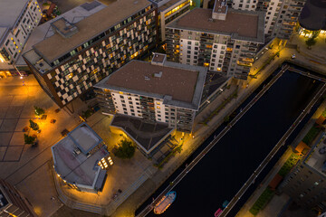 Aerial night time photo taken at sunset of the area in Leeds known as The Leeds Dock showing the...