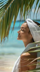 Elegant Woman Smiling with Closed Eyes under Palm Leaves, White Towel Wrapped around Head
