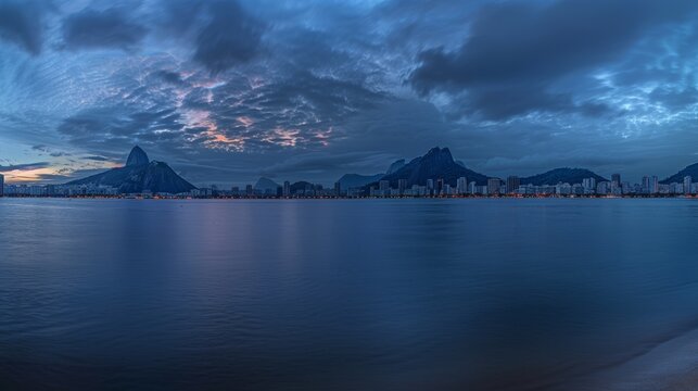 Scenic twilight panorama of the Rio de Janeiro skyline, Sugarloaf Mountain in the backdrop, --ar 16:9