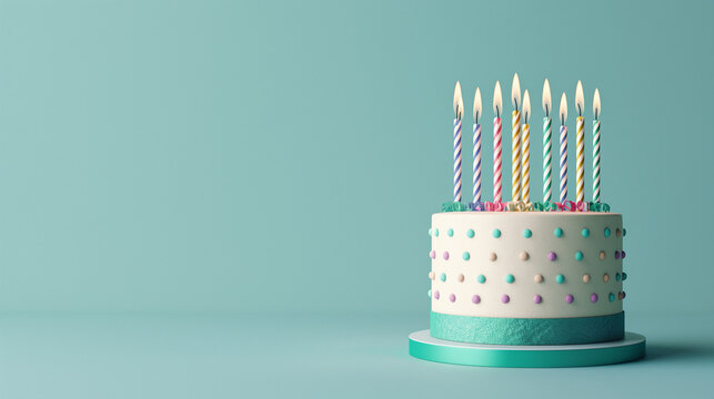 Chic birthday cake with pastel polka dots and nine brightly lit assorted candles on a dramatic backdrop