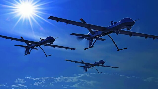 Three military drones flying in the blue sky
