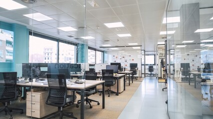 Interior of creative coworking workspace with computer desks