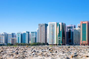 A modern new city rises straight out of the desert sands, satellite developments. Abu Dhabi. -...