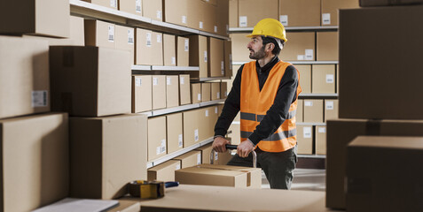 Warehouse clerk working and preparing deliveries - 784414966