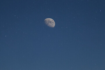 moon in the sky. large white moon is in the evening sky with stars, close-up, sky concept