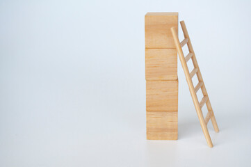 Wooden cubes with ladder on white background with customizable space for text