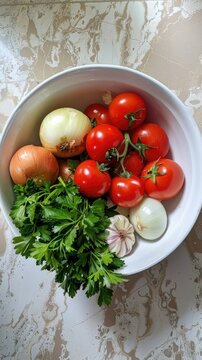 Bowl of fresh garden vegetables including tomatoes onions and parsley
