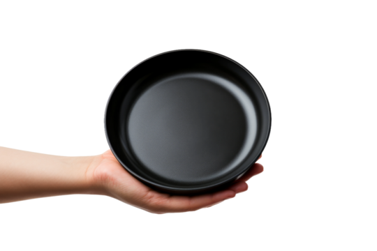 A Culinary Creation: Hand Masterfully Wielding a Black Frying Pan. On White or PNG Transparent Background.