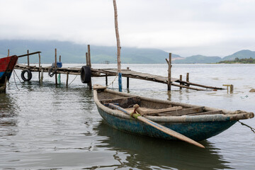 Traditional fishing boats tied up on the beach at Lap An Lagoon, Vietnam