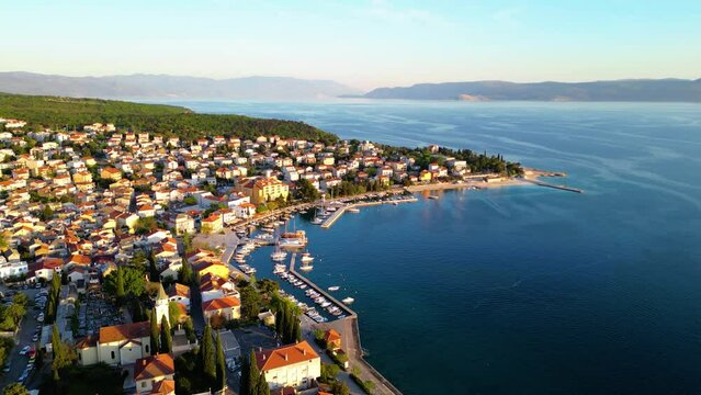 Selce is a picturesque coastal village nestled along the Adriatic Sea in Croatia, renowned for its stunning beaches, charming promenade, and relaxed atmosphere captured  by drone