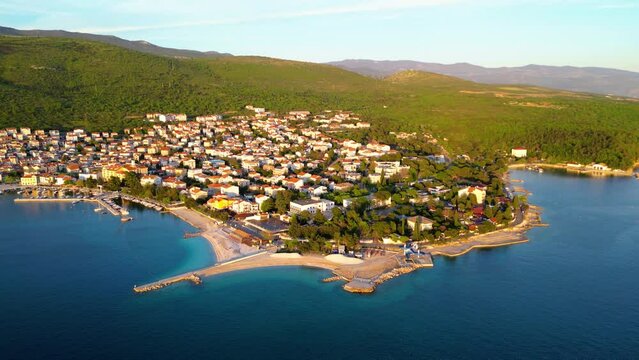 Selce is a picturesque coastal village nestled along the Adriatic Sea in Croatia, renowned for its stunning beaches, charming promenade, and relaxed atmosphere captured  by drone