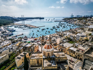 A beautiful fishing town in Malta, aerial shot - 784462110