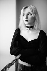 Young beautiful blonde girl in black and white photographs.