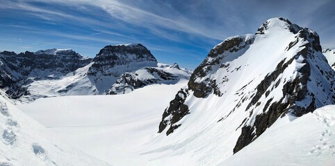 Ski tour over the T&uuml;felsjoch with a view of the Piz Russein mountain and the Bocktschingel Boggtschingel peak. Ski mountaineering in the Glarus Alps, Switzerland. Skimo. Skitour in Winter.