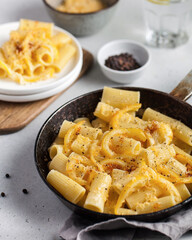 Delicious pasta with cheese sauce and lemon zest. Italian cuisine, the recipe.