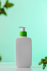 A minimalist white bottle with a green pump on a soft teal background, natural beauty care. Skin care