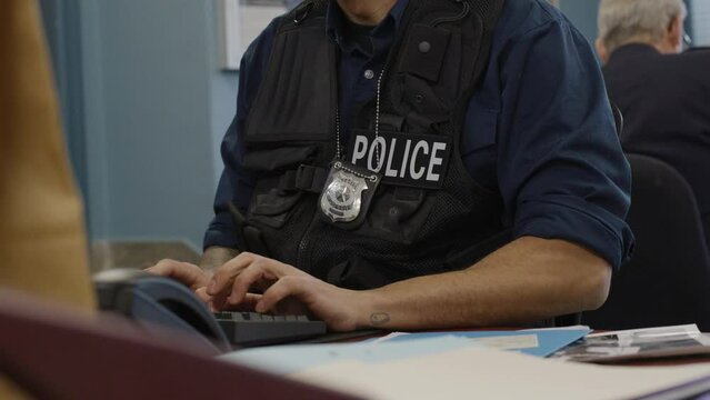 Close up typing cop on keyboard