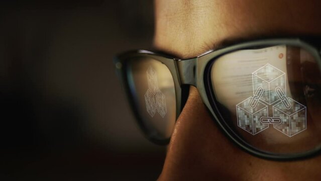 The search for information on the Internet is reflected in glasses and animated footage with a symbol of blockchain technology appears on the glasses. The concept of introducing AI. Cg