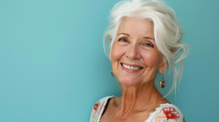 Portrait of a beautiful senior woman isolated on blue background