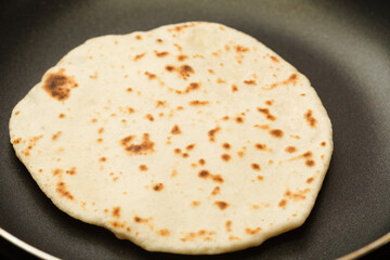 Making sourdough leavened pita-like flatbread on dry frying pan
- 784487137