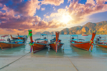 Longtale boats at the beautiful beach Thailand early morning at dawn beautiful sky clouds over sharks in the ocean