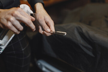 Barber razor in a profecional hand