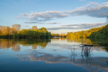 april landscape with lake and trees
