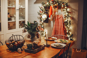 Christmas dinner at the decorated table with delicious food