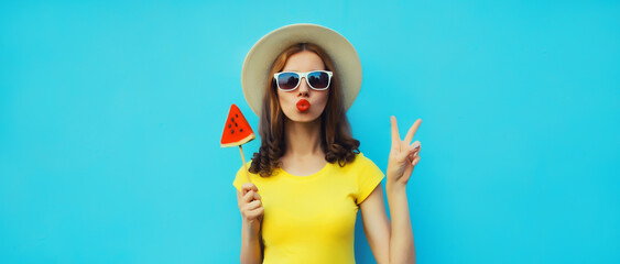 Summer portrait of stylish young woman with juicy lollipop or ice cream shaped slice of watermelon