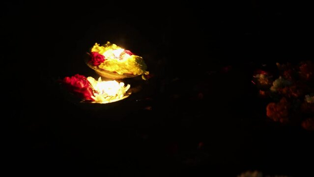 holy offerings oil lamp at river shore on religious occasion at night from different angle