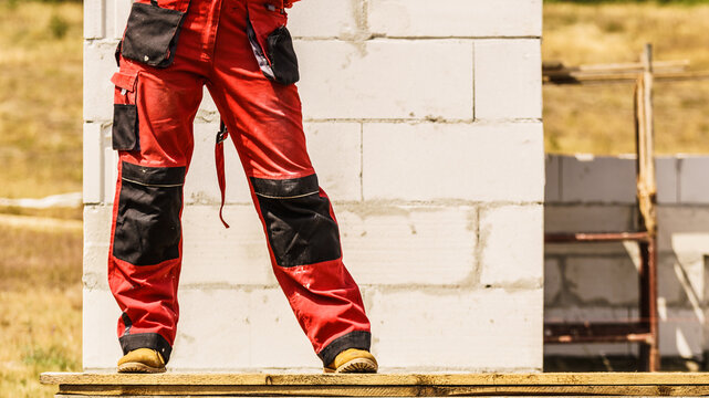 Person wearing red worker trousers