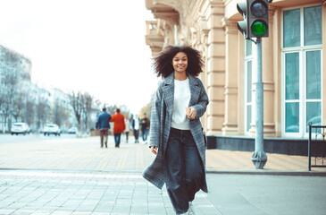Young stylish positive african american woman crossing zebra, Happy black girl on crosswalk outdoors