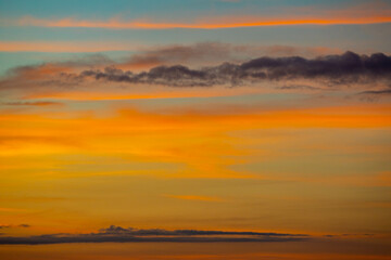 Fototapeta na wymiar Early morning sky with multicolored clouds