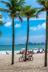 Copacabana beach with palms and bicycle  in Rio de Janeiro, Brazil. Copacabana beach is the most...