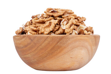 Walnut kernel halves, in wooden bowl isolated on white background. Shelled, dried seeds of the...