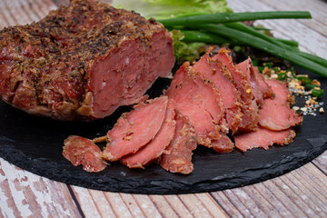 Vegan mock meat, made of wheat gluten, plant based. Steamed, roasted and sliced