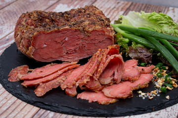 Vegan mock meat, made of wheat gluten, plant based. Steamed, roasted and sliced