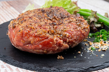 Vegan mock meat, made of wheat gluten, plant based. Steamed, roasted and sliced