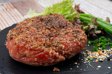 Vegan mock meat, made of wheat gluten, plant based. Steamed, roasted and sliced