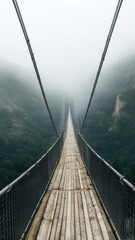 Obraz premium The bridge over the abyss in the fog.