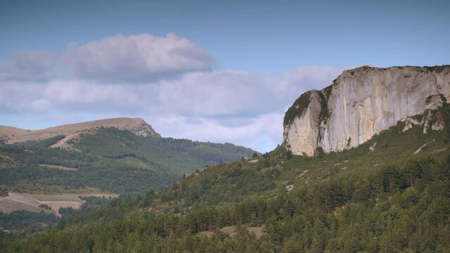 Timelapse of clouds moving over massif of the Baronnies Provencales Regional Nature Park in France. Mountain landscape.