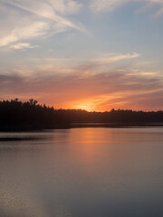 sunset on a forest lake